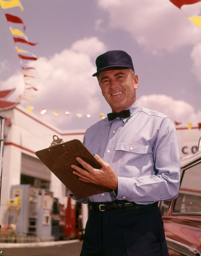 Detail of 1950s 1960s Mechanic Holding Check List On Clipboard by Anonymous