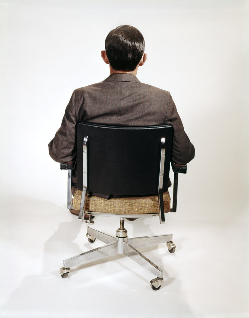 Detail of 1960s Business Man Back View Sitting In Office Chair by Anonymous