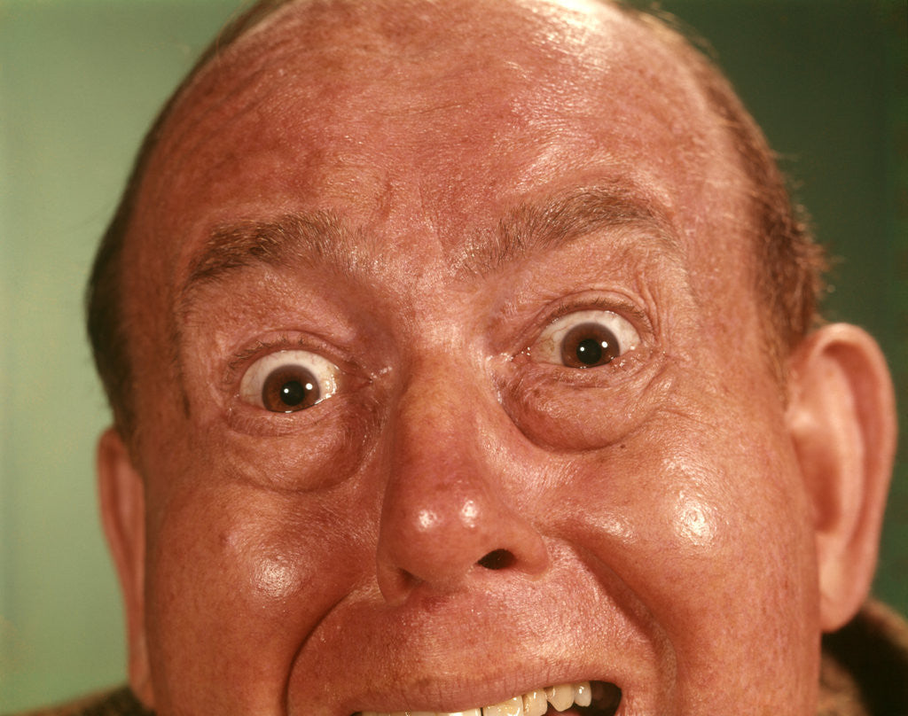 Detail of 1960s Man Forehead To Chin, Silly Wacky Funny Facial Expression by Corbis