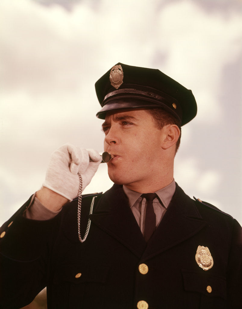Detail of 1960s Portrait Man Policeman Traffic Cop Blowing Whistle by Corbis