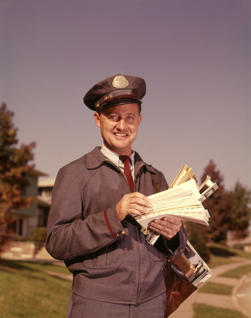 Detail of 1960s Mailman Holding Letters Mail Leather Mailbag In Suburban Neighborhood by Anonymous