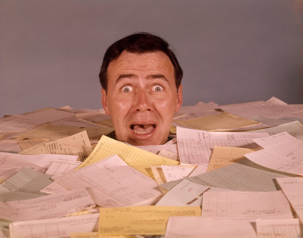 Detail of 1960s Overwhelmed Screaming Bug-Eyed Man Drowning In Paper Work by Corbis