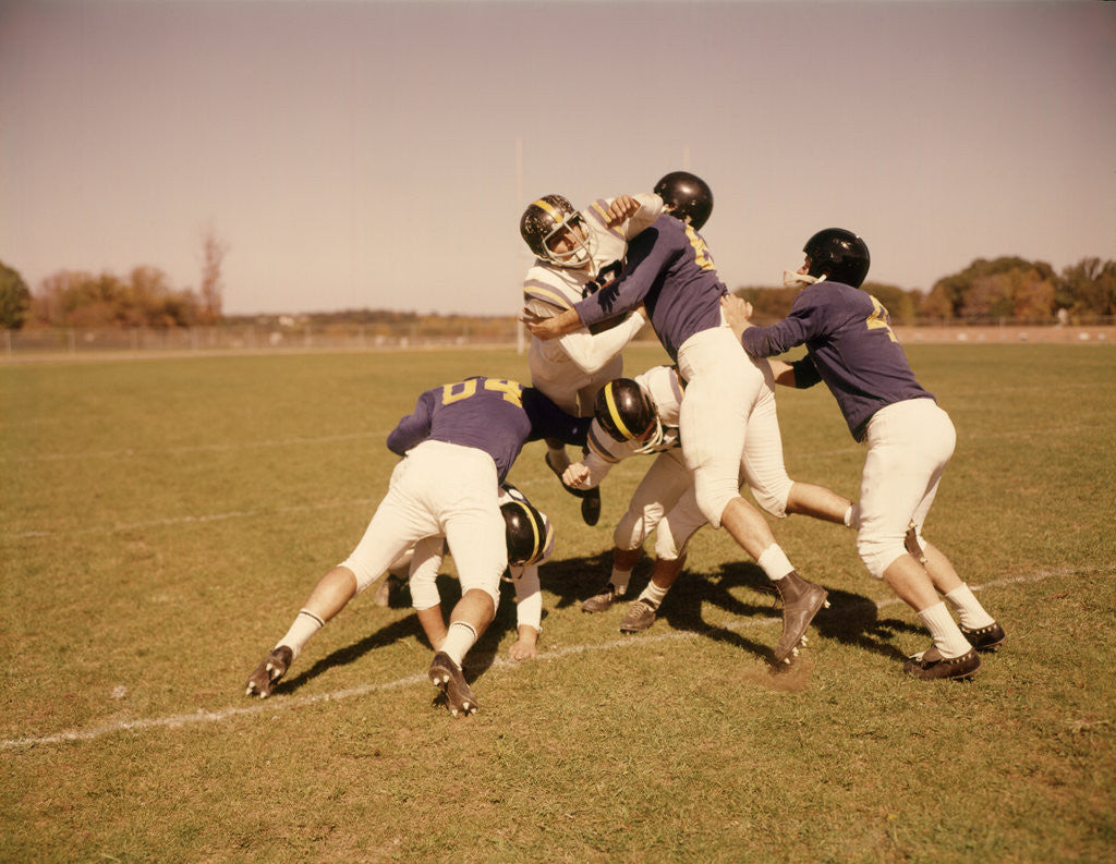 Detail of 1960s Six Football Players Running Blocking Tackling On Scrimmage Field by Anonymous