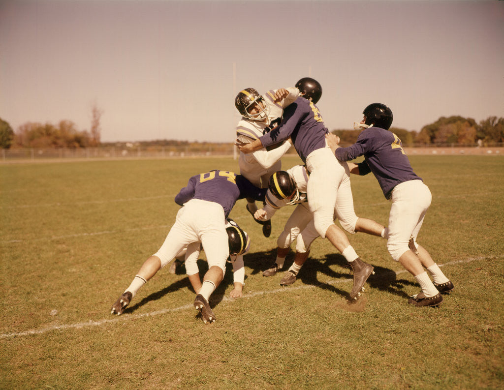 Detail of 1960s Six Football Players Running Blocking Tackling On Scrimmage Field by Corbis