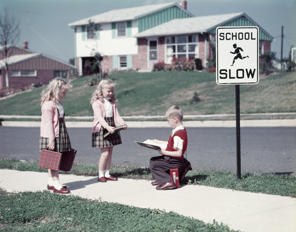 Detail of 1950s Twin Girls and Boy On Sidewalk By School by Anonymous