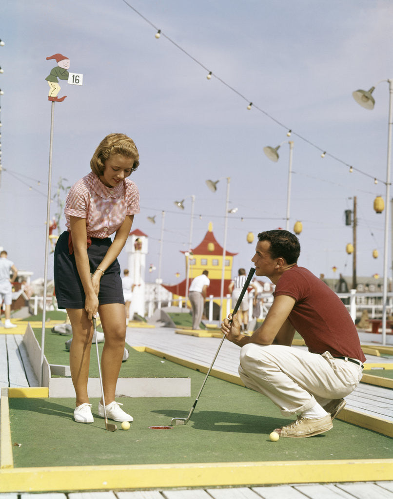 Detail of 1950s 1960s Young Couple Man Woman Play Miniature Golf Summer Amusement by Anonymous