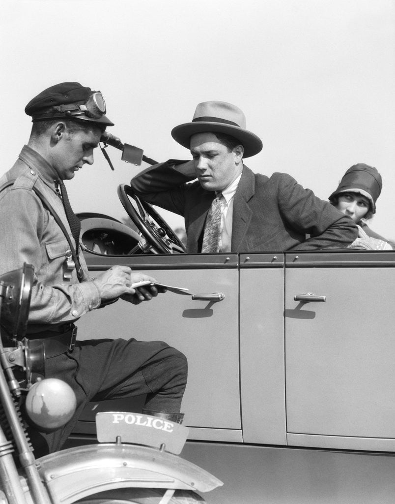 Detail of 1920s Motorcycle Policeman Writing A Speeding Ticket To A Couple Sitting In Convertible Sedan by Anonymous