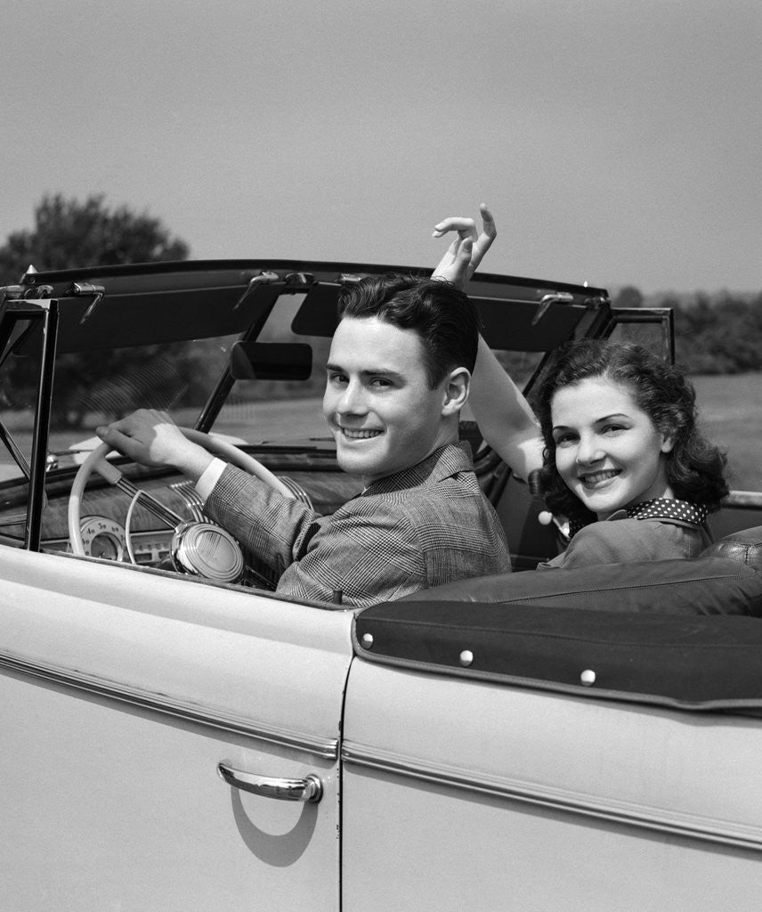 Detail of 1941 1940s Couple Man Woman On A Date Sitting In Pontiac Convertible Automobile by Anonymous