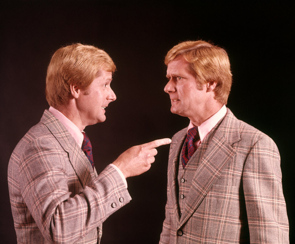 Detail of 1970s Angry Red Haired Man In Plaid Suit Arguing With Himself by Anonymous