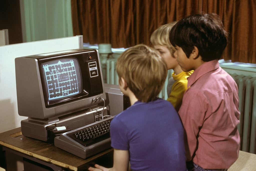 Detail of 1980s 3 Elementary School Boys Operating Early Radio Shack Trs80 Computer Playing Game by Anonymous