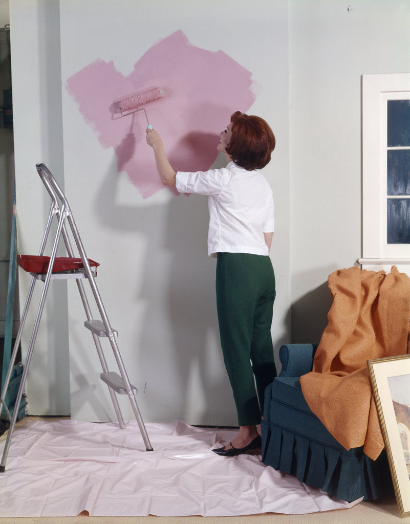 Detail of 1960s 1970s Woman Painting Wall With Paint Roller Indoor by Anonymous