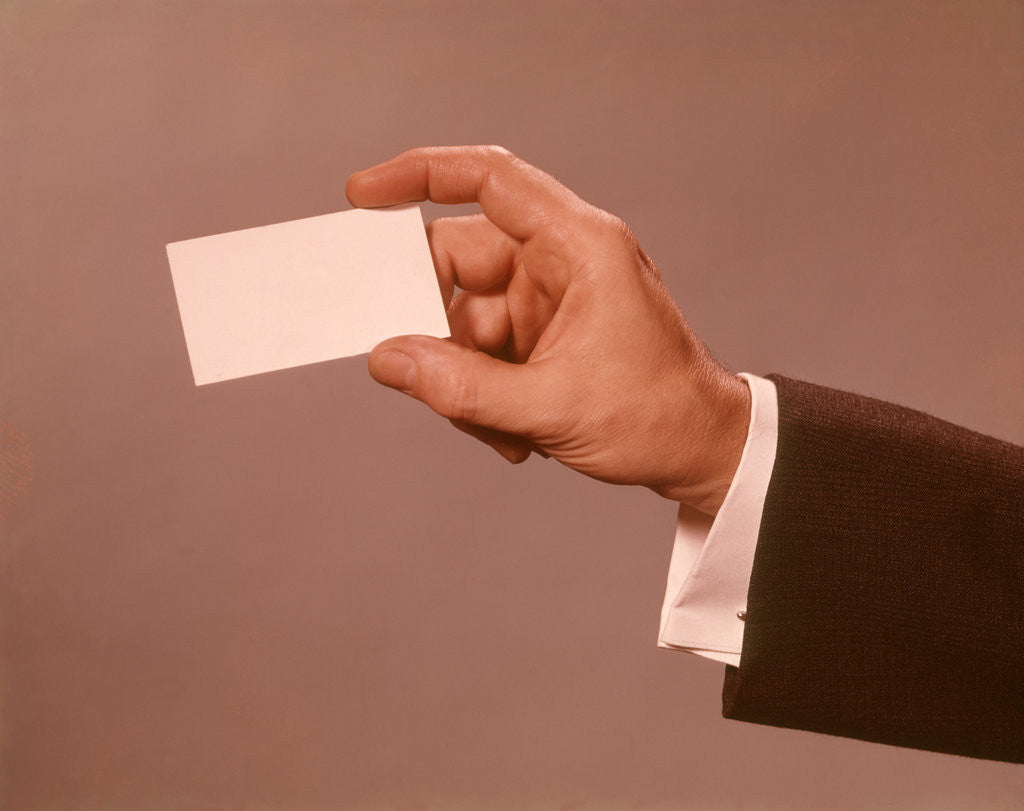 Detail of 1960s 1970s Man Hand Holding Blank Business Card by Anonymous