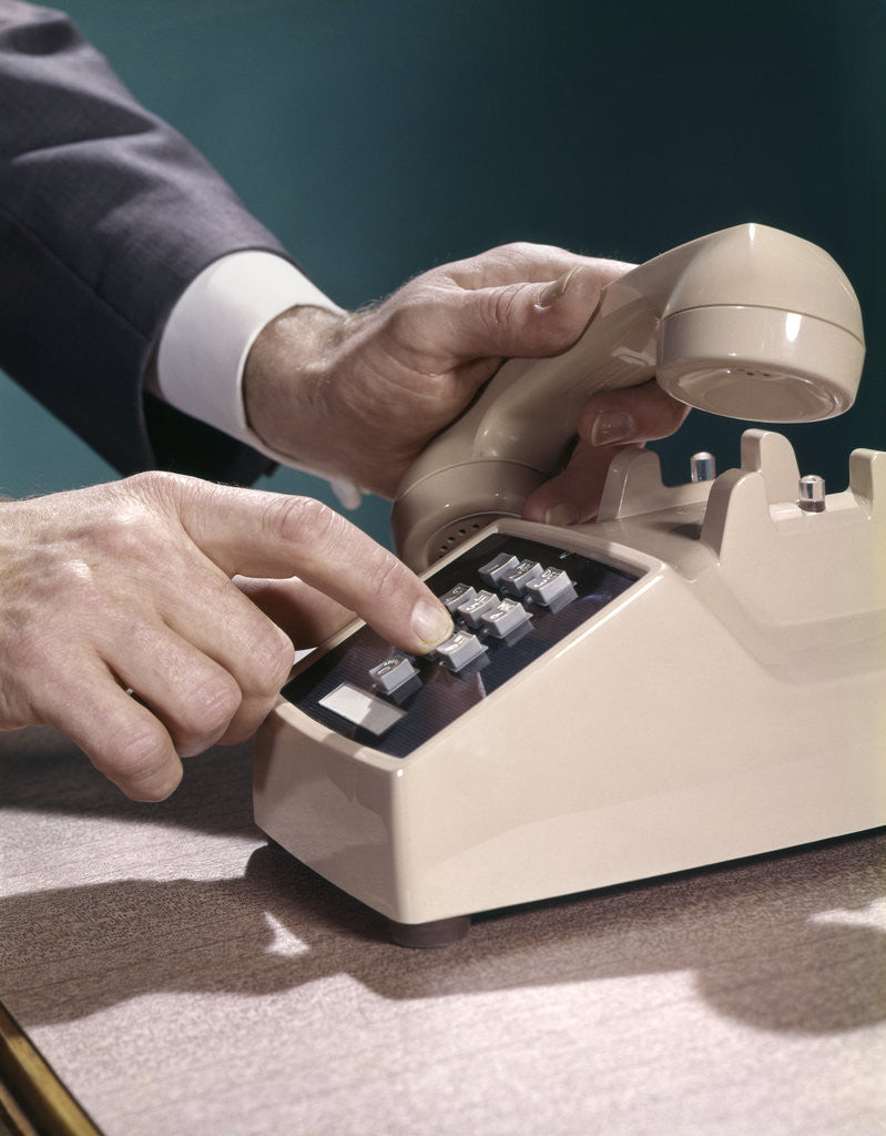 Detail of 1960s 1970s Man Hands Businessman Salesman Dialing Touch Tone Telephone by Anonymous