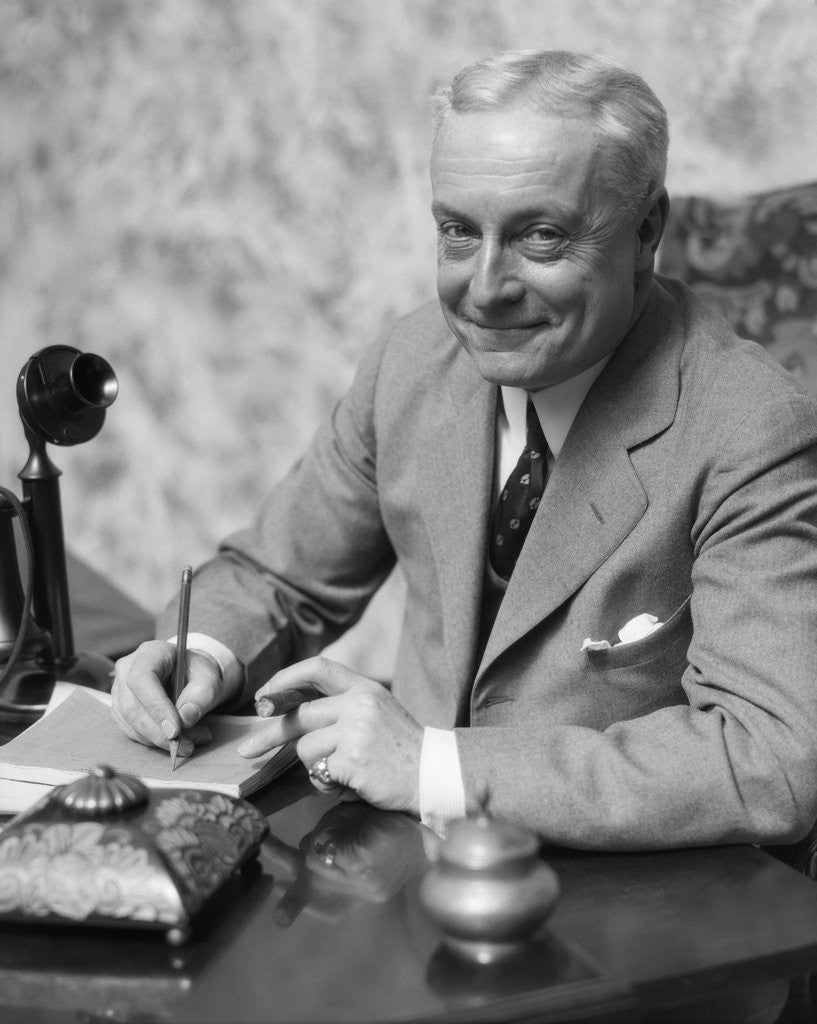 Detail of 1920s 1930s Man Businessman,Salesman Sitting At Desk Smoking Cigar Writing A Memo by Anonymous