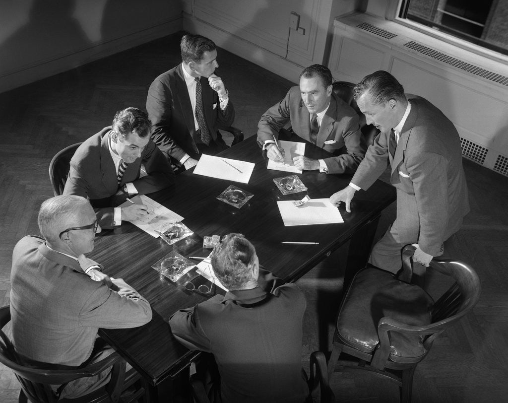 Detail of 1950s Six Men Businessmen Salesmen In Suits Meeting Around Conference Table by Corbis