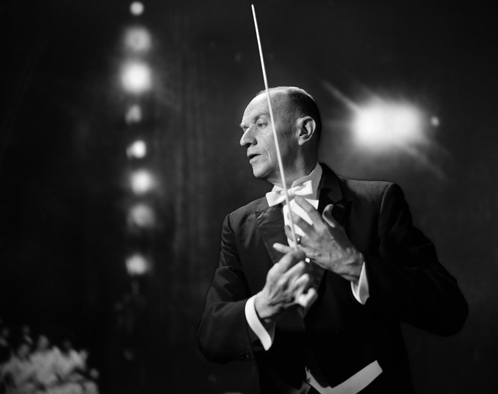 Detail of 1960s 1970s Portrait Of Man In White Tie And Tails Conducting An Orchestra In Symphony Hall by Anonymous