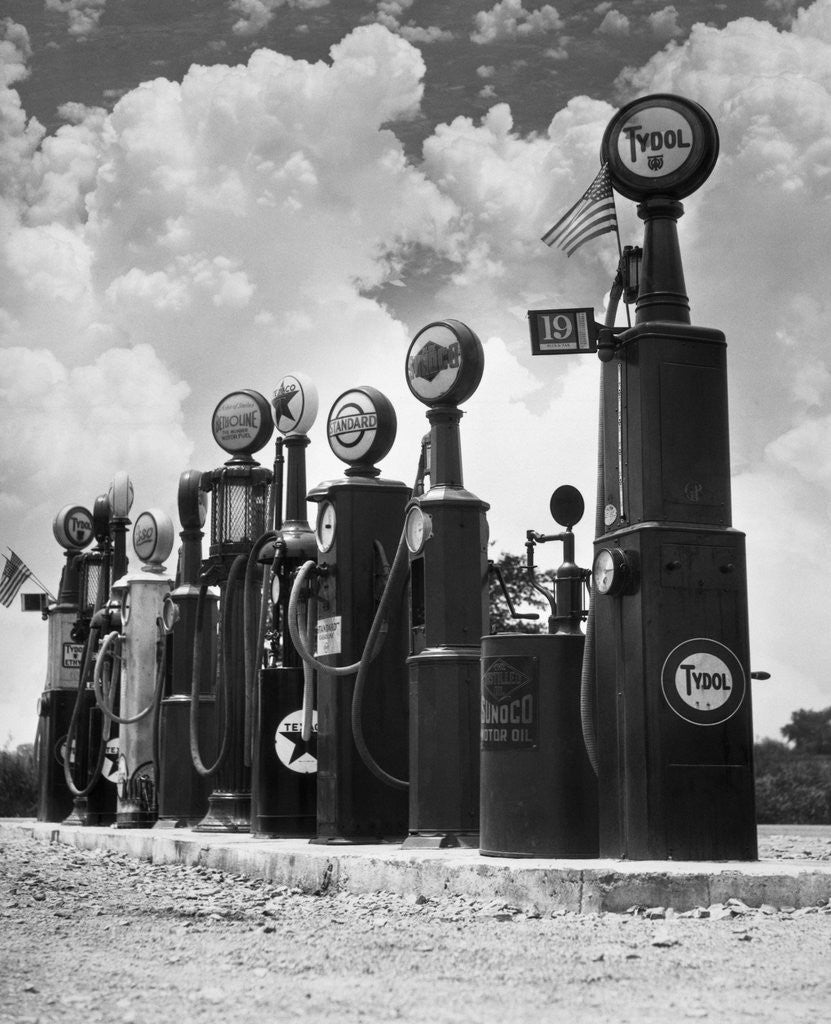 Detail of 1920s 1930s Line Of Gasoline Pumps by Corbis
