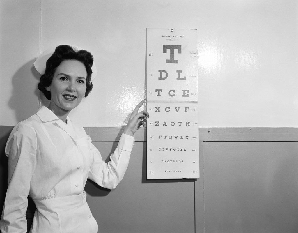 Detail of 1950s 1960s Woman Nurse Pointing To Eye Chart by Corbis