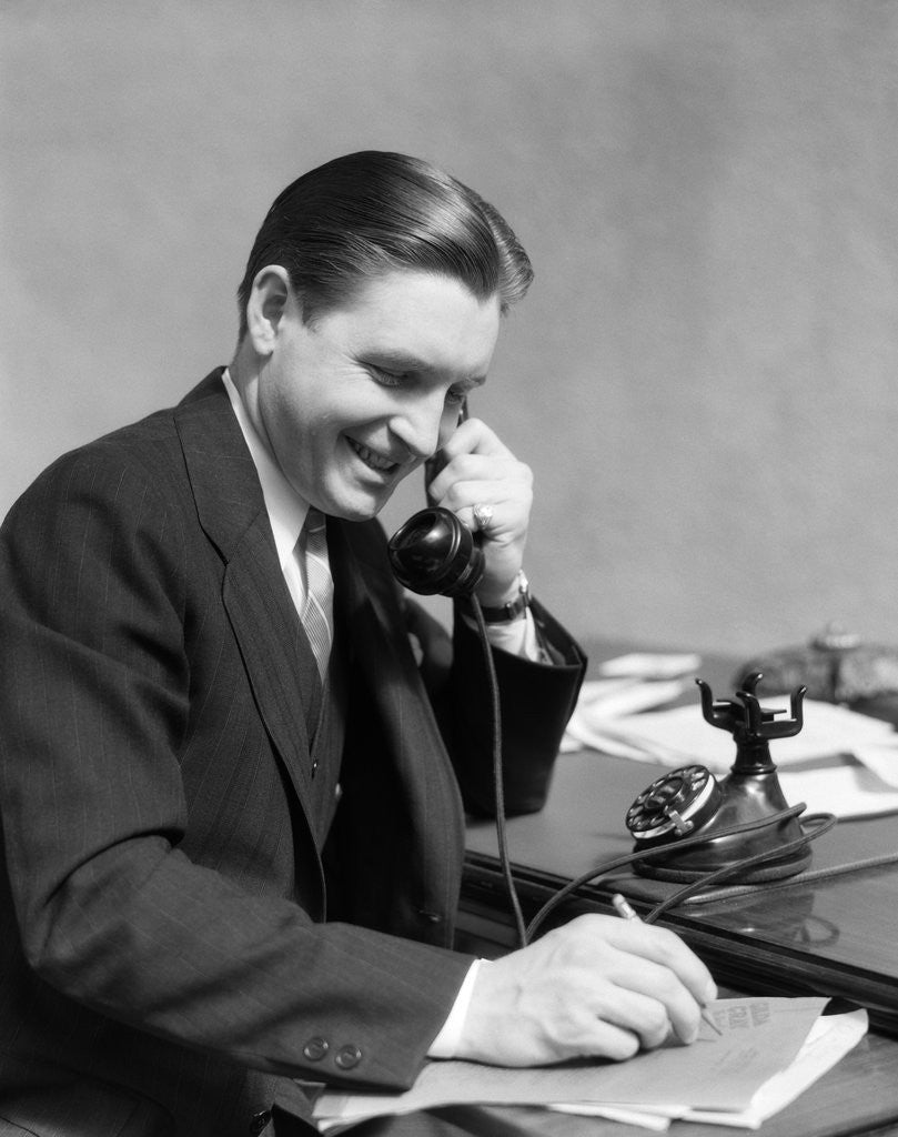 Detail of 1930s Business Man On Telephone In Office Writing by Anonymous