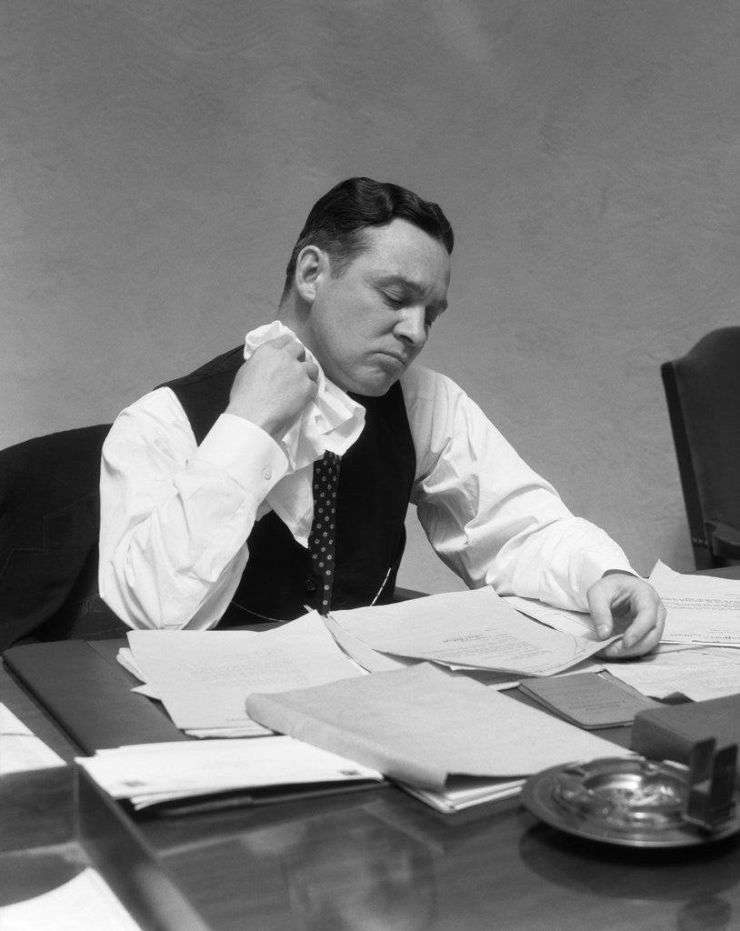 Detail of 1930s Man At Desk In Office Wiping Neck With Handkerchief by Anonymous