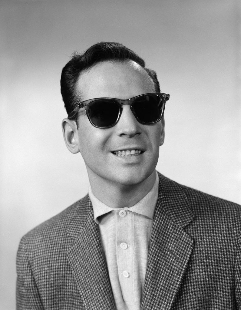 Detail of 1950s 1960s Portrait Of Blind Man Wearing Sports Jacket Shirt And Very Dark Protective Sunglasses by Corbis