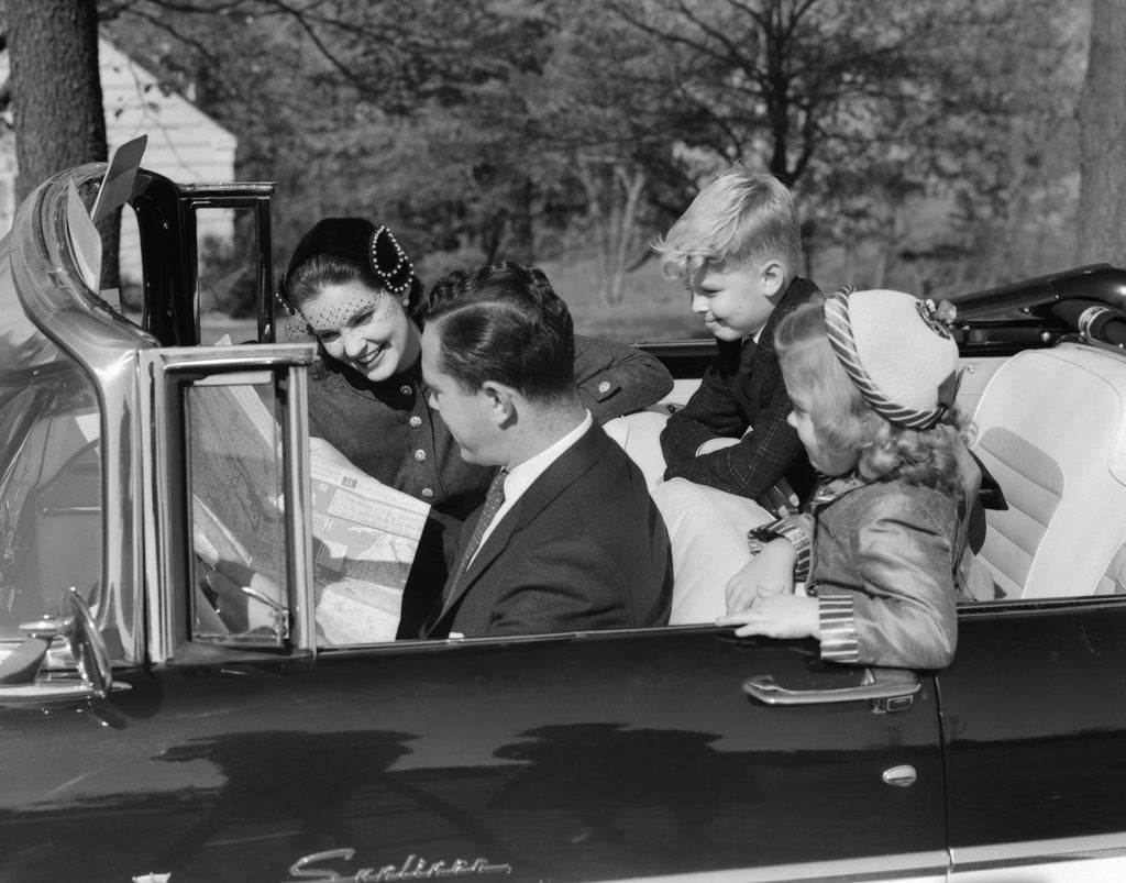Detail of 1950s Family Father Mother Daughter Son In Convertible Reading Map by Anonymous