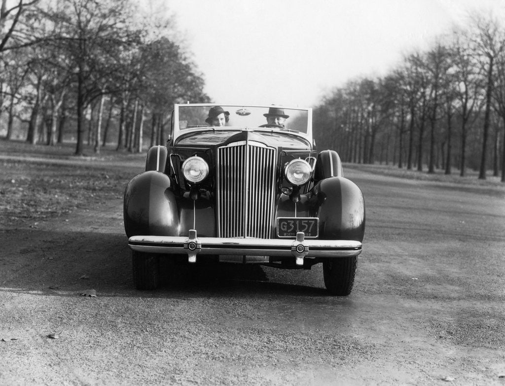 Detail of 1930s 1935 Couple Driving Packard Convertible Automobile by Anonymous