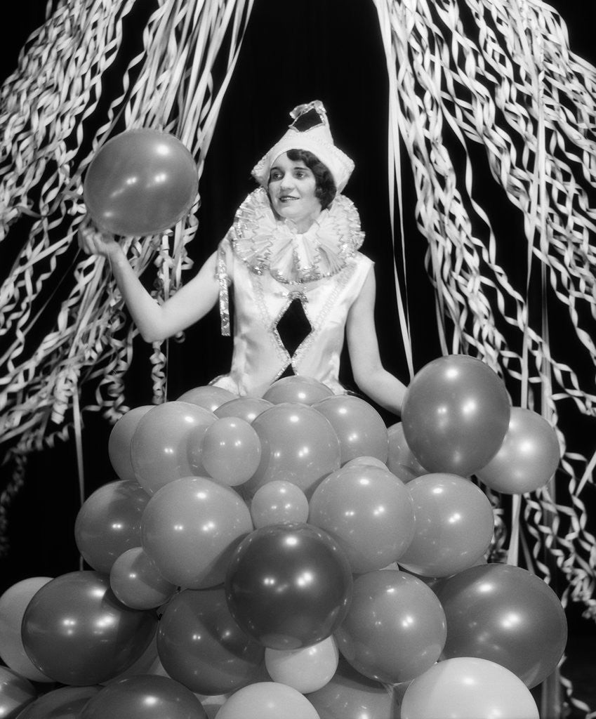 Detail of 1920s 1930s Young Woman Pierrot Clown Amid Party Balloons And Paper Streamers by Corbis