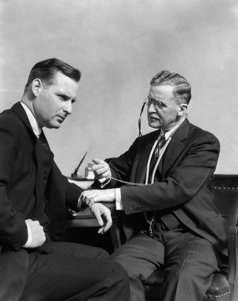 Detail of 1930s Man Doctor Taking Pulse Of Man Patient by Corbis