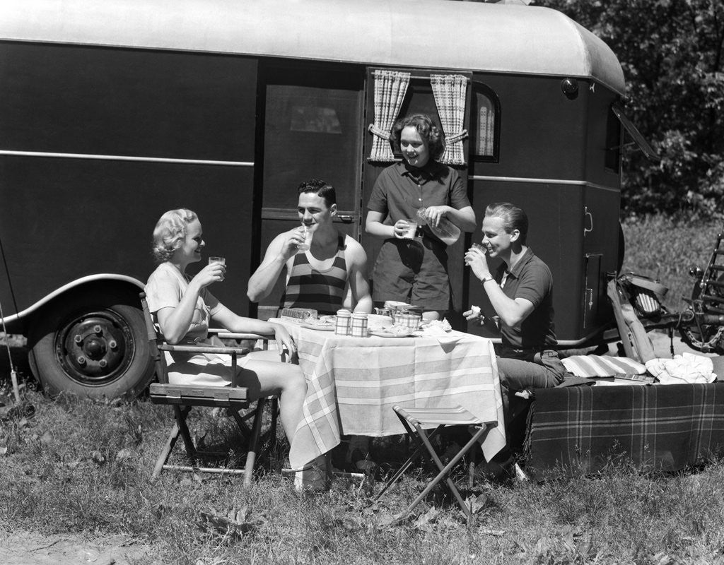 Detail of 1930s Two Couples Eating Picnic Lunch Beside Camping Trailer by Anonymous