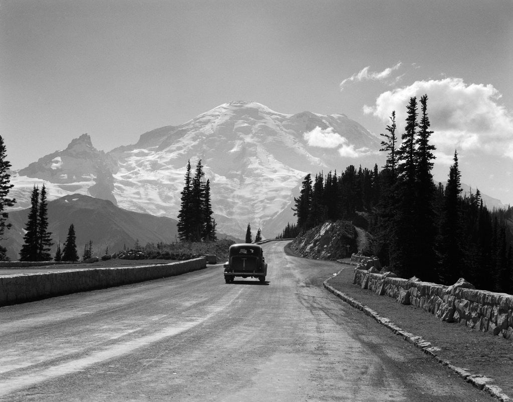 Detail of 1930s Sedan Automobile Driving High Mountain Road Towards Snow Capped Mount Rainier Washington State Usa by Anonymous
