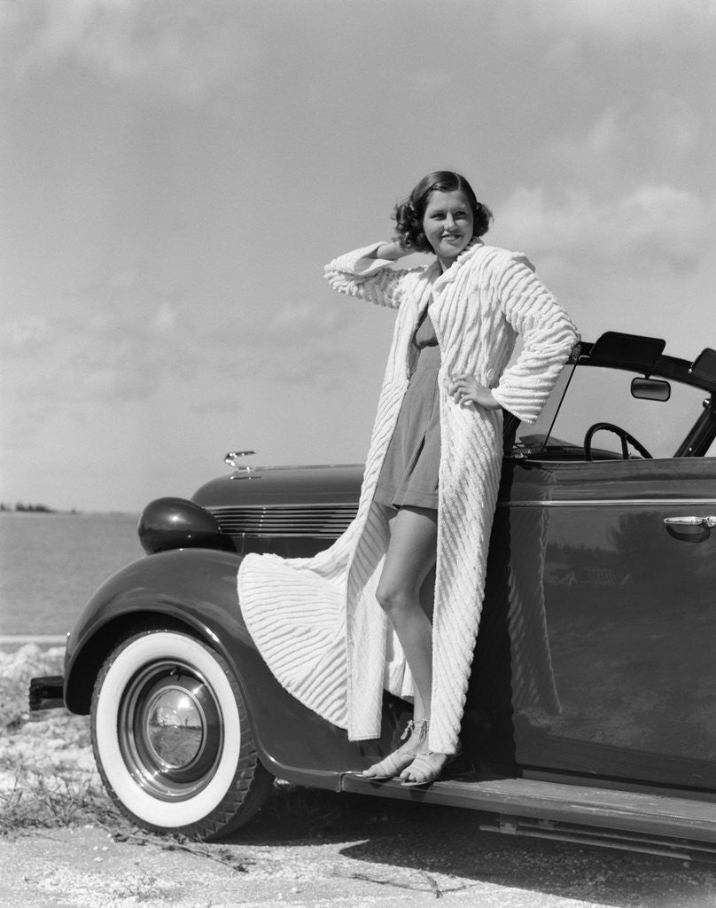 Detail of 1930s 1940s Woman Wearing Chenille Beach Robe Posing On Running Board Of Convertible Roadster Automobile by Anonymous