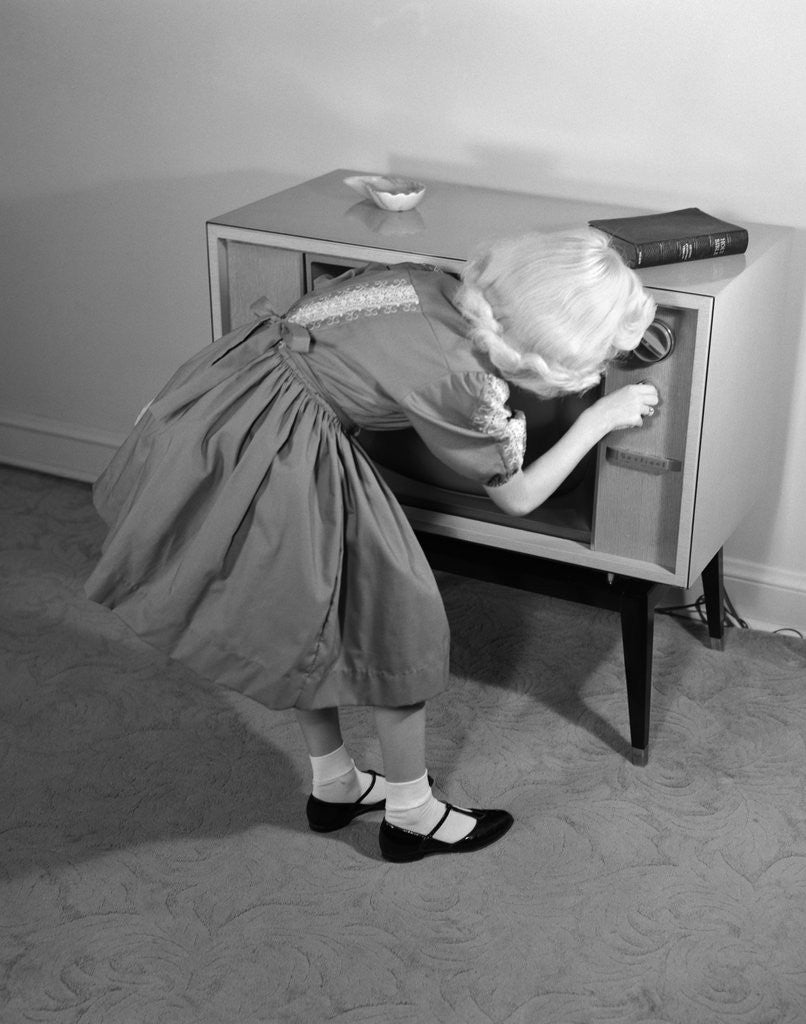 Detail of 1960s Little Girl Turning On Television Set by Anonymous