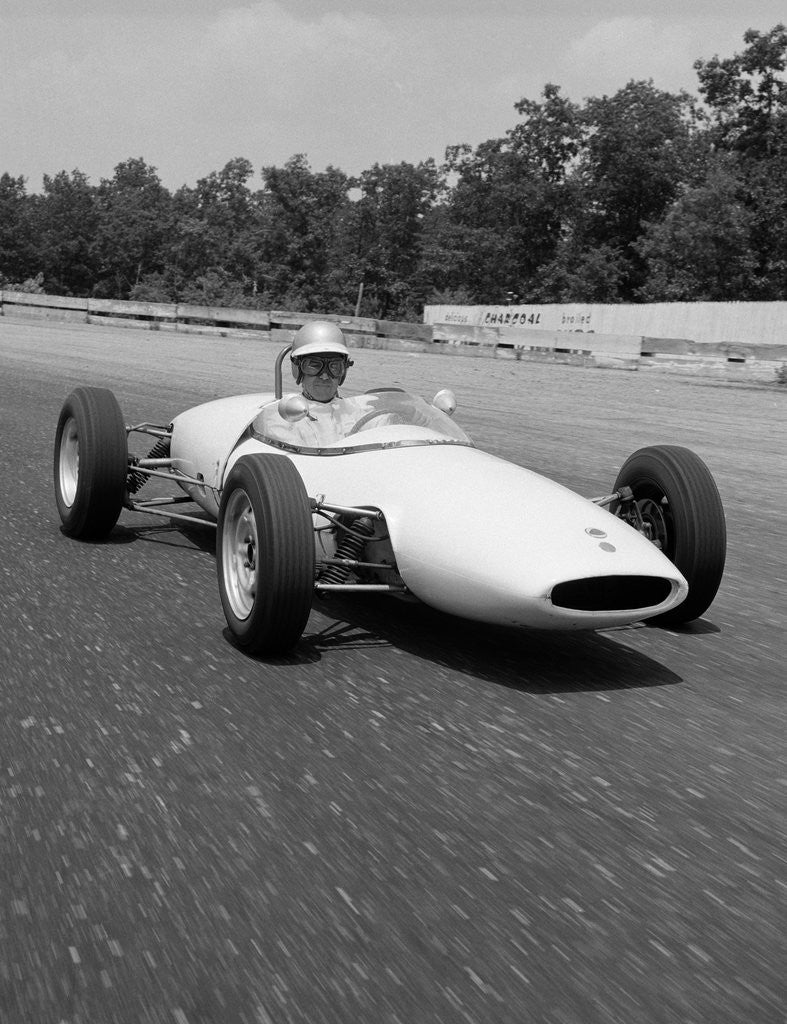 Detail of 1960s Lotus Ford Race Car Speeding Around Track by Anonymous