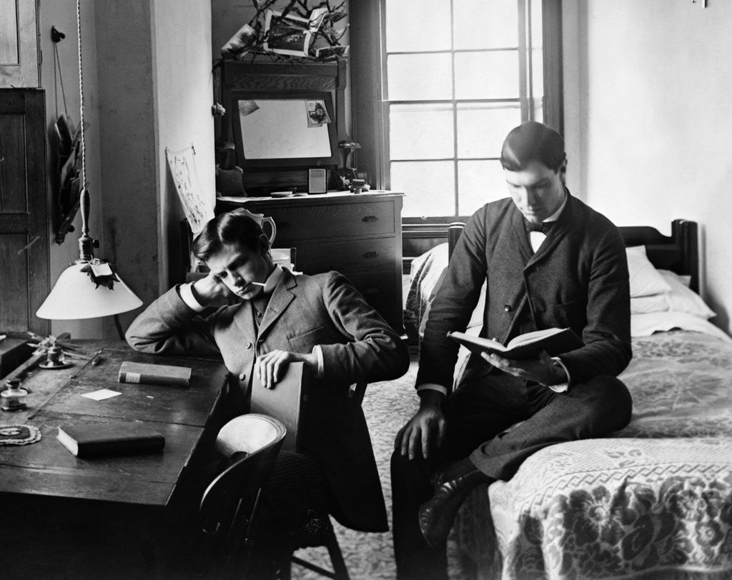 Detail of 1890s Pair Of Male Students Studying In Dorm Room by Corbis