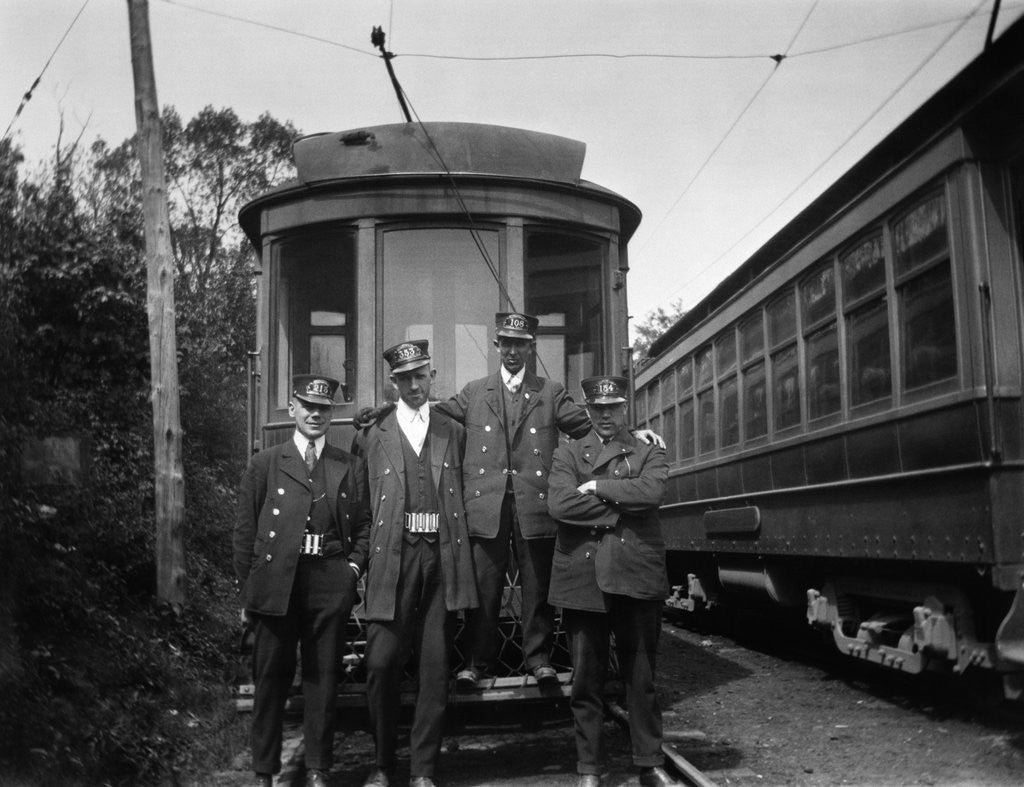 Detail of 1900s Conductors Posing In Front Of Trolley Car by Anonymous