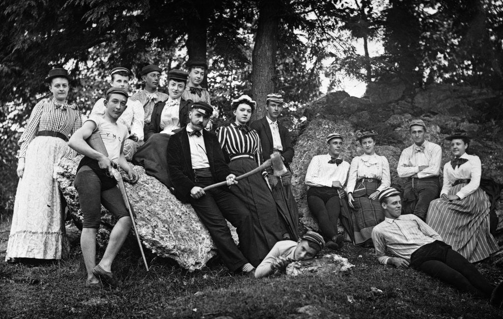 Detail of 1890s 1900 Teenage Students In Woods Leaning Against Rocks by Corbis