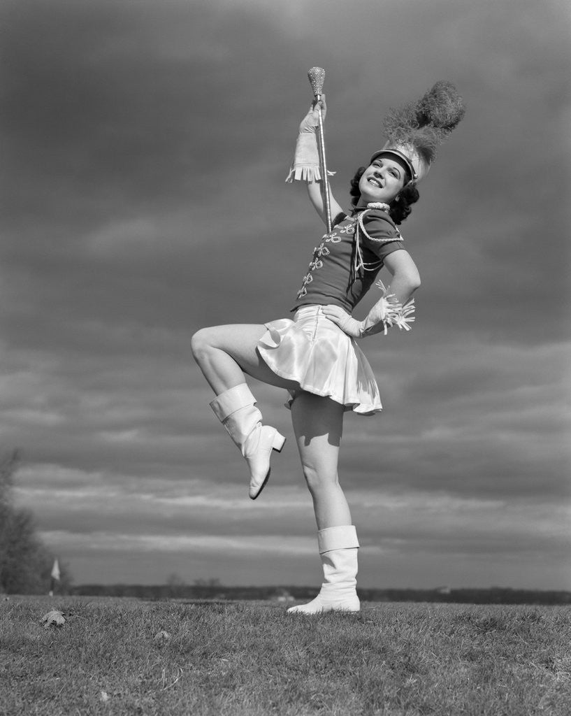 Detail of 1940s Woman Drum Major In Majorette Band Uniform Twirling Baton by Corbis