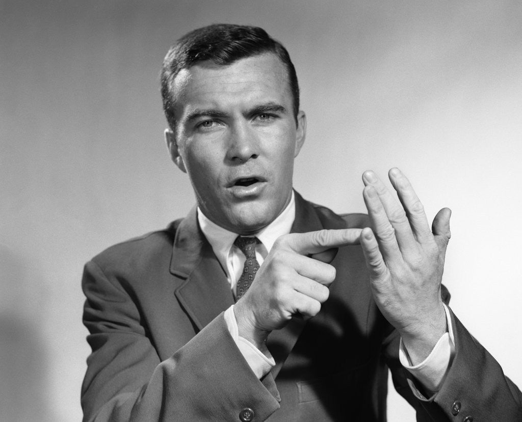 Detail of 1950s Earnest Salesman Talking Gesturing With Hands by Corbis