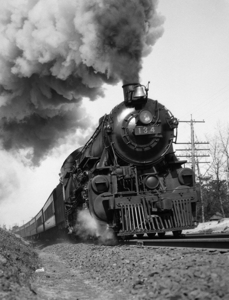 Detail of 1920s 1930s Steam Engine Pulling Passenger Train Smoke Billowing From Exhaust Stack by Anonymous