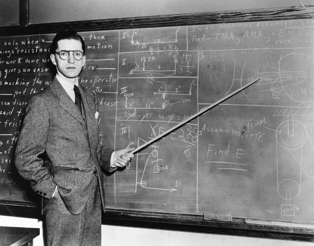 Detail of 1930s Man Teacher Looking At Camera With Pointer At Blackboard by Anonymous