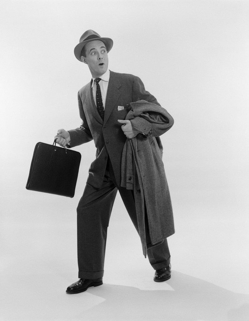 Detail of 1950s Surprised Businessman Holding Briefcase Taking A Step Forward Looking Back by Corbis