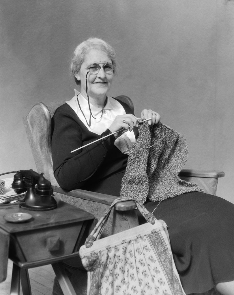 Detail of 1930s Elderly Woman Wearing Pince-Nez Glasses Sitting Knitting by Anonymous