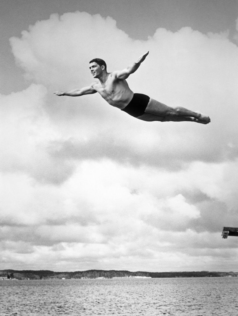 Detail of 1930s Man Swan Diving From High Diving Board Outdoor by Corbis