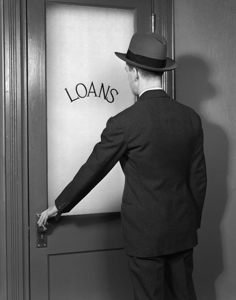 Detail of 1930s 1940s Man In Suit And Hat Opening Door Marked Loans by Anonymous