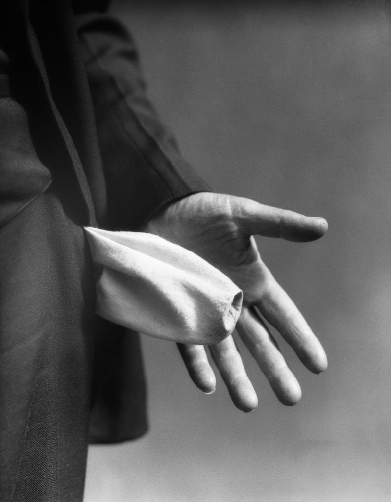 Detail of 1930s Man's Hand Turning Empty Pants Pocket Inside Out by Anonymous
