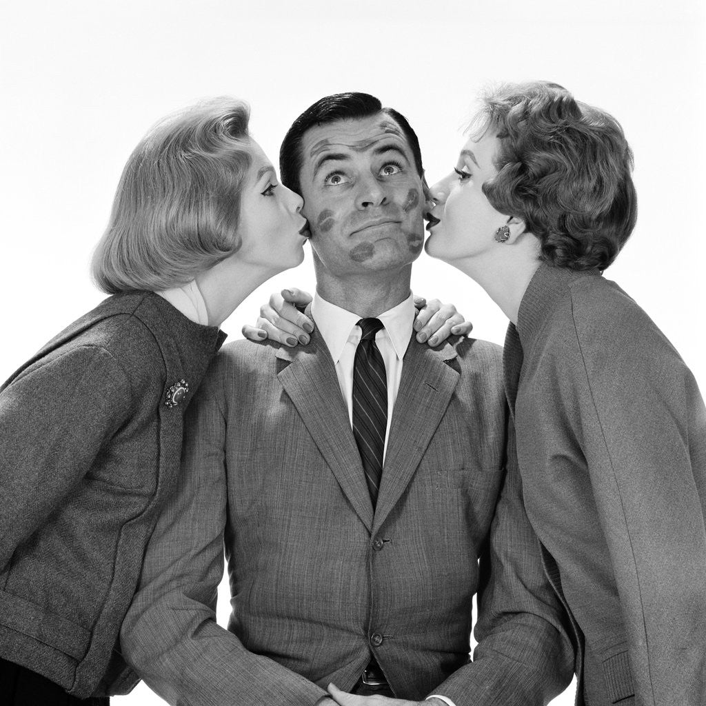 Detail of 1950s Two Women Kissing Single Man On Opposite Cheeks His Face Covered With Lipstick Marks by Anonymous