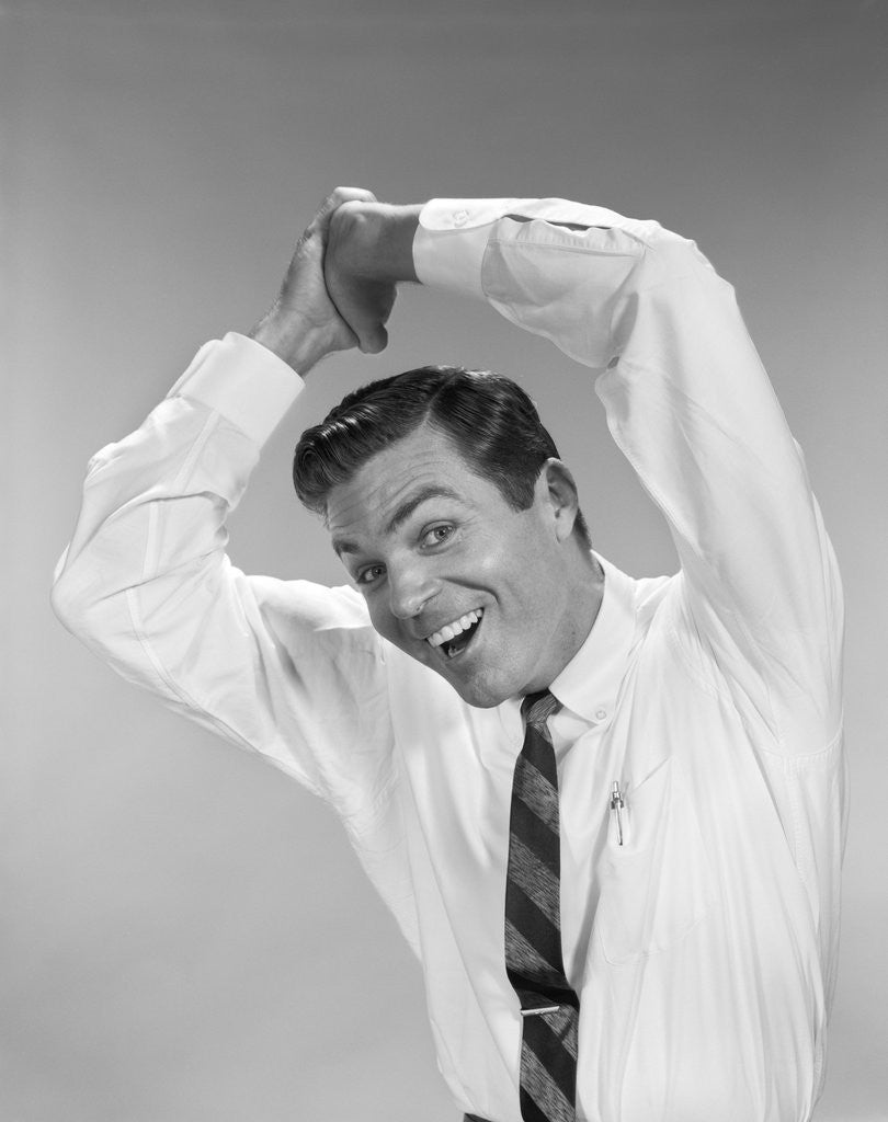 Detail of 1960s Businessman In Shirtsleeves Clasping Hands Together Overhead by Anonymous