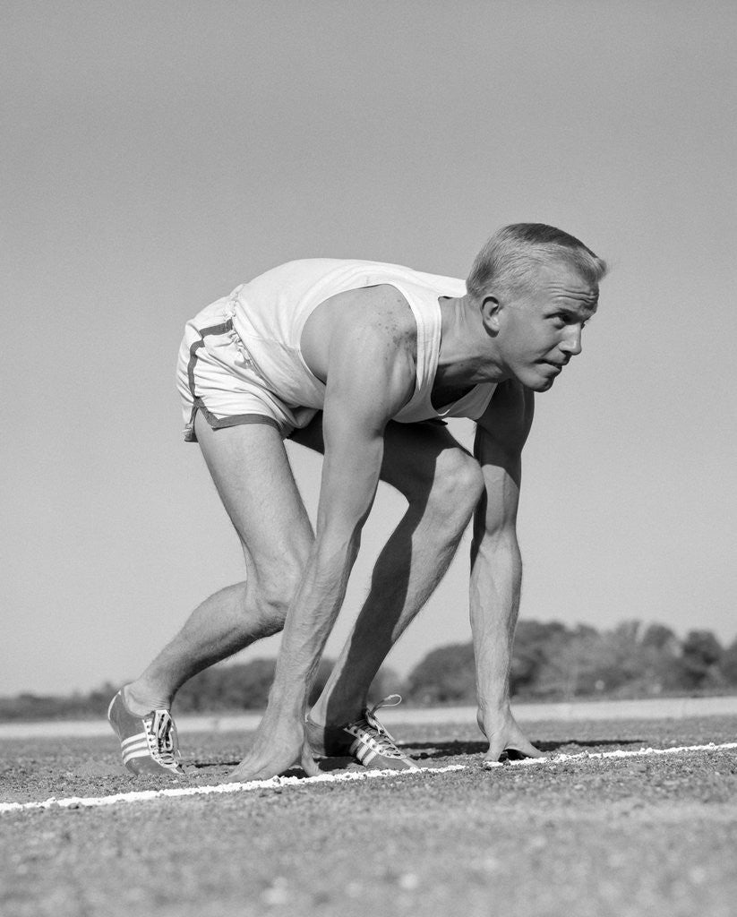 Detail of 1960s Man Sprinter Runner At The Starting Line For Foot Race Outdoor by Anonymous