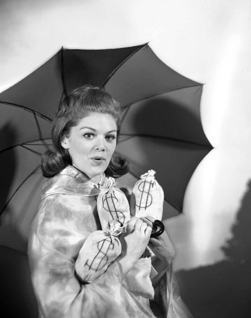 Detail of 1960s Woman With Umbrella Holding Bags Of Money Save Your Money For A Rainy Day by Anonymous